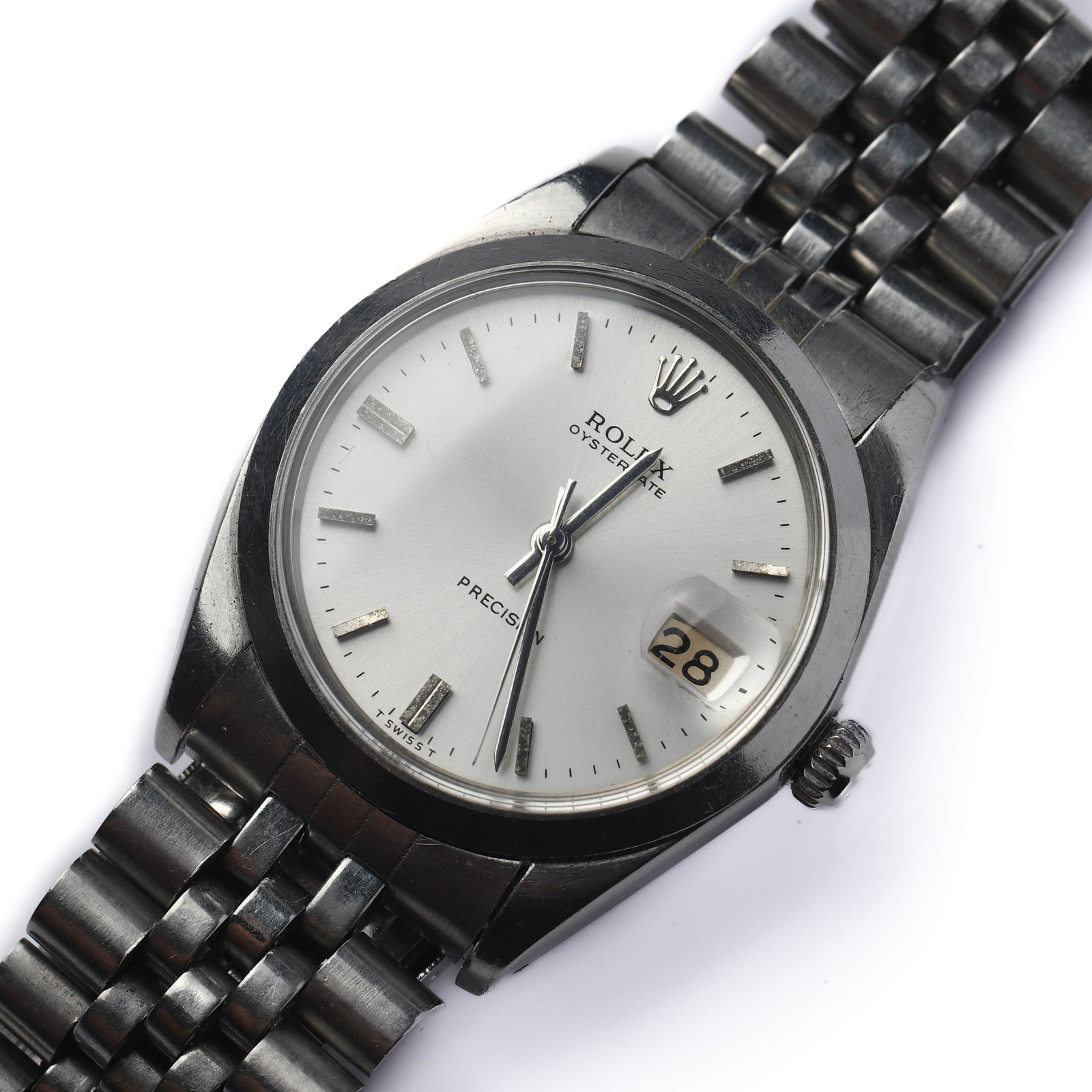 ROLEX OYSTERDATE PRECISION STAINLESS STEEL WRISTWATCH: Dimensions Dial diameter: 1 1/2 in. (37.8 mm) Description A stainless steel wristwatch by Rolex, featuring a silvered sunburst dial with applied baton hour markers and central hands, signed “Rolex
