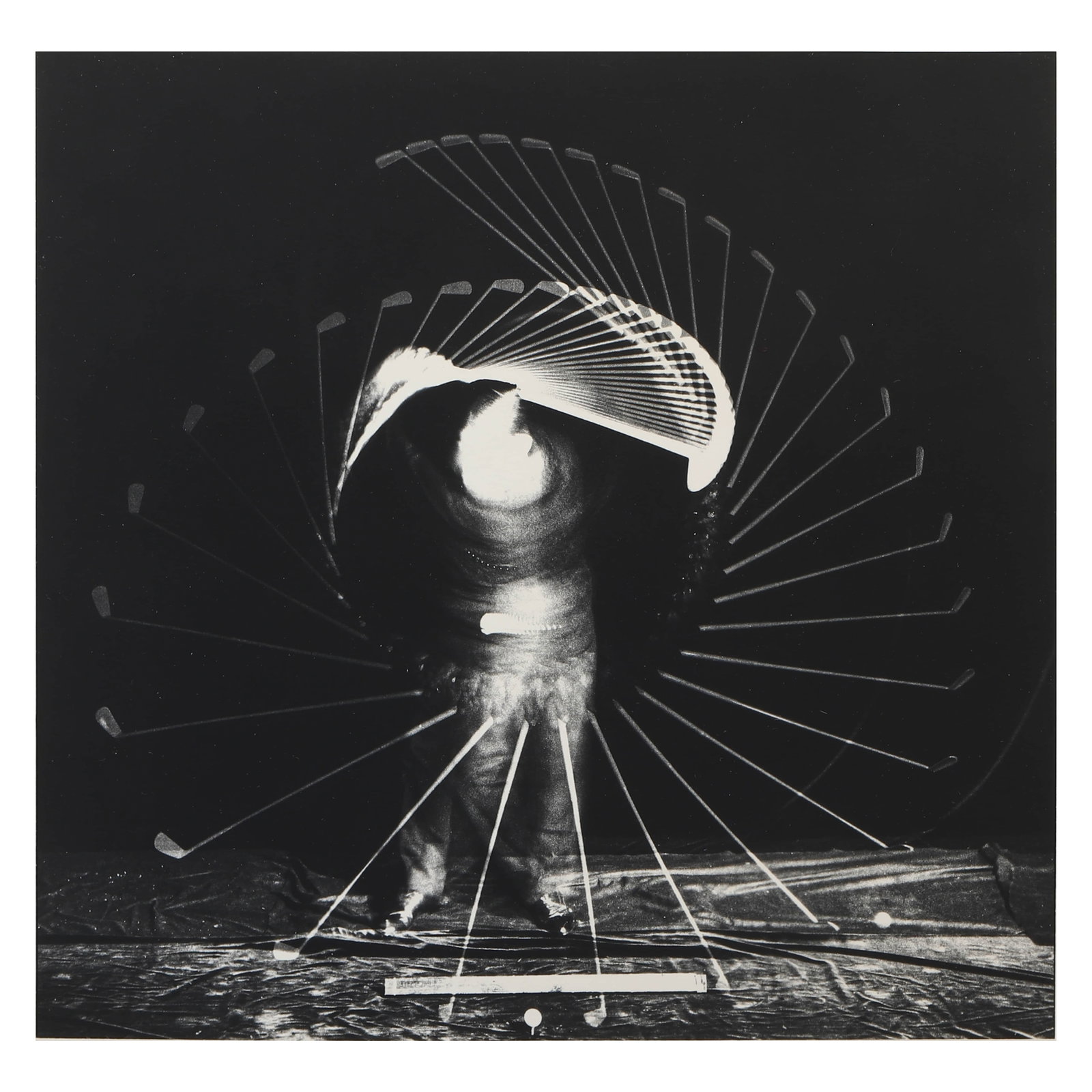 HAROLD E. EDGERTON (1903–1990)BOBBY JONES: Silver gelatin print, mounted on board Signature Pencil signed on verso Dimensions Photograph: 7 3/4 × 8 1/8 in. (19.8 × 20.5 cm) Frame: 15 3/4 × 19 3/4 in. (40 × 50 cm) Description Harold E. Edge
