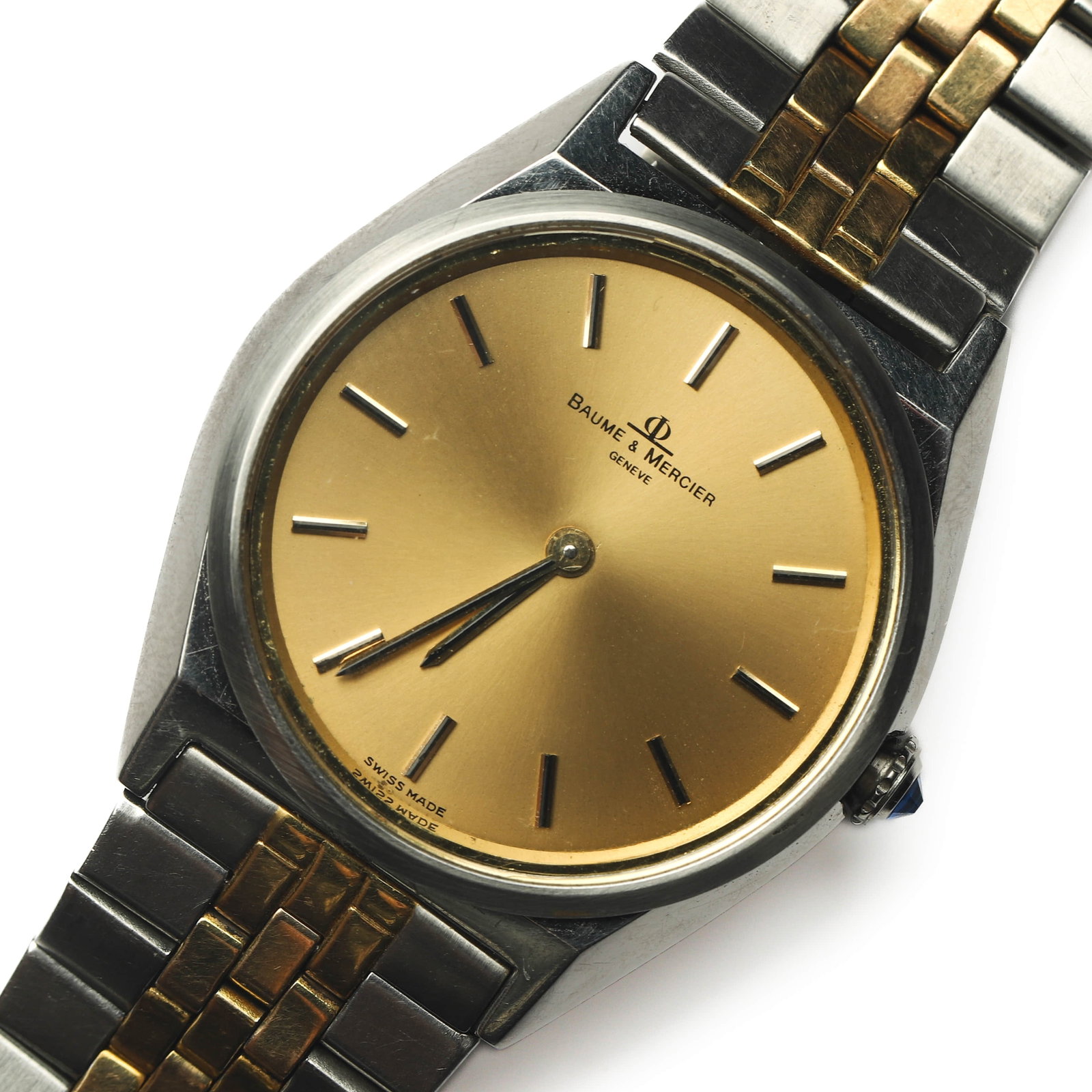 BAUME & MERCIER GENTLEMAN'S WRISTWATCH: Dimensions Case diameter 1 1/2 in. (3.73 cm) Weight 73.4g Description A Baume & Mercier gentleman's wristwatch featuring a gold-tone dial with applied baton hour markers and matching baton hands, sign