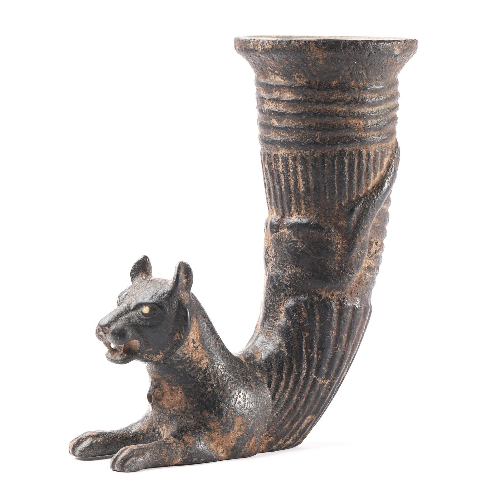 AN ANCIENT STYLE BRONZE RHYTON WITH FELINE TERMINAL.: DIMENSIONS Height: 8 1/16 in. (20.5 cm) DESCRIPTION & ANALYSIS This rhyton, cast in bronze, features a flaring ribbed vessel terminating in the form of a crouching feline with alert expression,