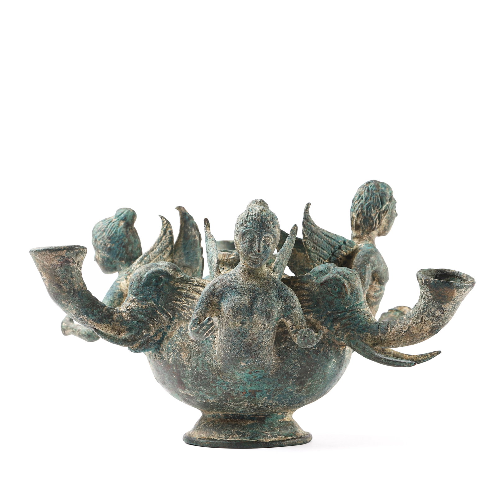 ANCIENT BRONZE VESSEL WITH FEMALE FIGURES AND ELEPHANT SPOUTS: Dimensions?Height: 5 7/8 in. (15 cm)Width: 10 1/4 in. (26 cm) Description?This ancient bronze vessel is crafted in an elaborate form, featuring four female figures with wings emerging from the body,