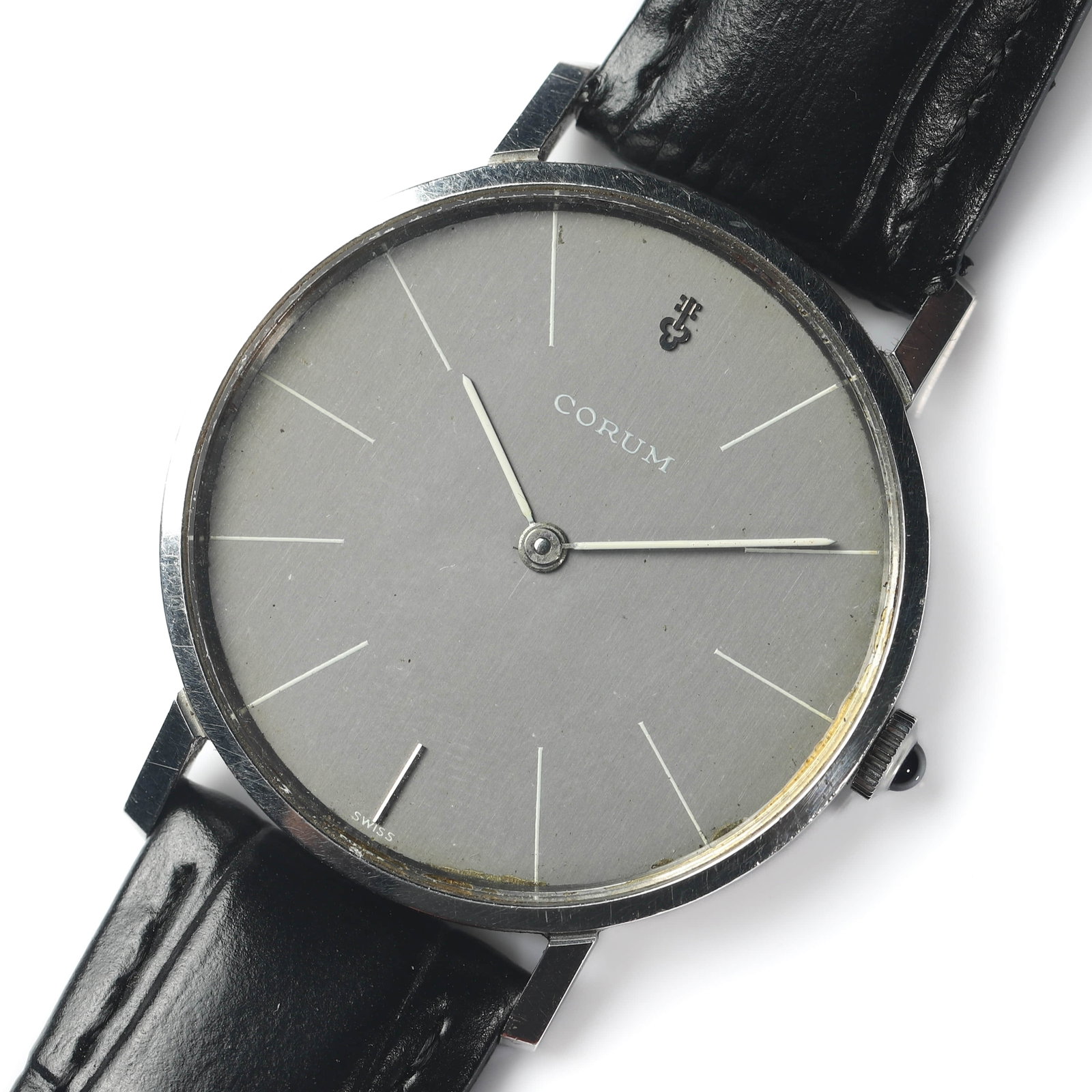 CORUM GENTLEMAN'S ULTRA-THIN WRISTWATCH: Dimensions Dial Diameter 1 7/16 in. (37.2 mm). Length 9 1/2 in. (24 cm). Weight 30 g. Description A Corum gentleman's ultra-thin wristwatch, Swiss made. The round stainless steel case enclosing a silv