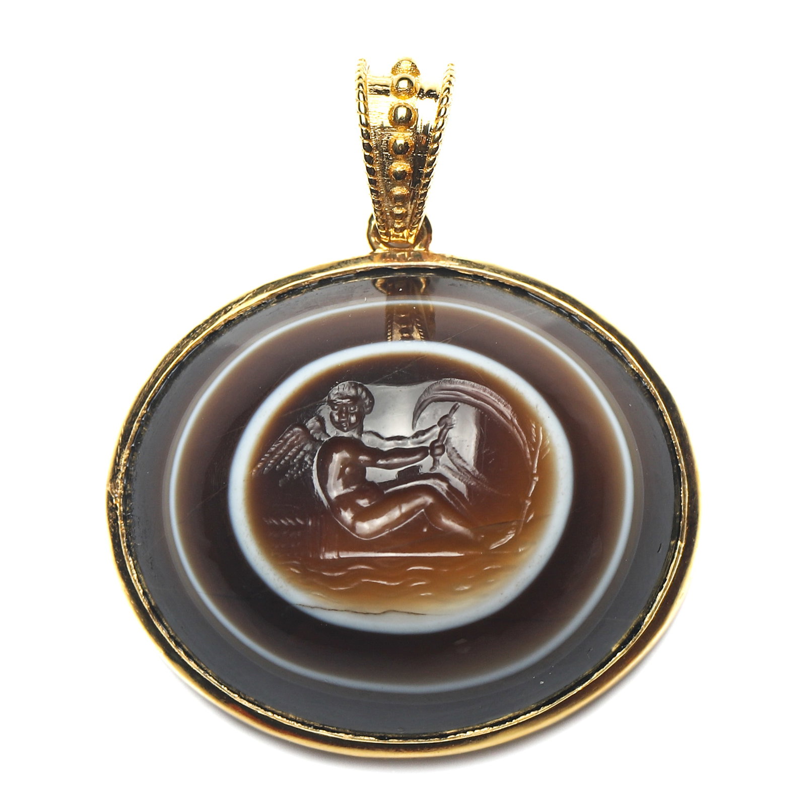ANCIENT ROMAN BANDED AGATE CUPID INTAGLIO GOLD PENDANT: Dimensions 1 3/16 × 1 in. (3.0 × 2.6 cm) Weight 7.9 g Description An Ancient Roman-style gold pendant featuring a finely carved banded agate intaglio depicting Cupid navigating the river of love, us