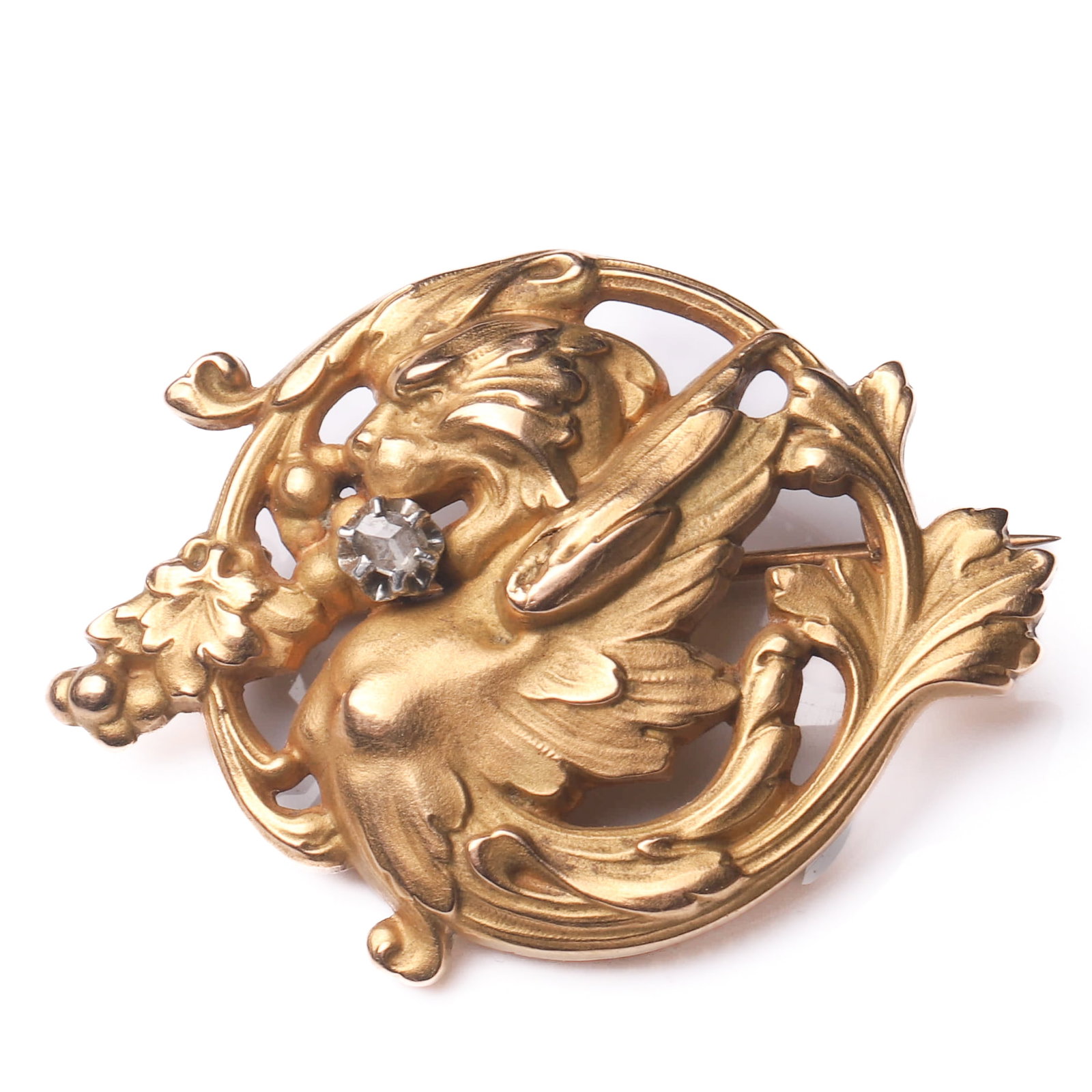 ART NOUVEAU PERIOD (1880–1920), A FRENCH GOLD CHIMERA DRAGON BROOCH WITH DIAMOND: Dimensions Height: 1 9/16 in. (3.9 cm), Width: 1 1/16 in. (2.7 cm) Weight:5.56 g Description An exquisite French Art Nouveau gold brooch, finely handcrafted in 18K gold, designed in the form of a