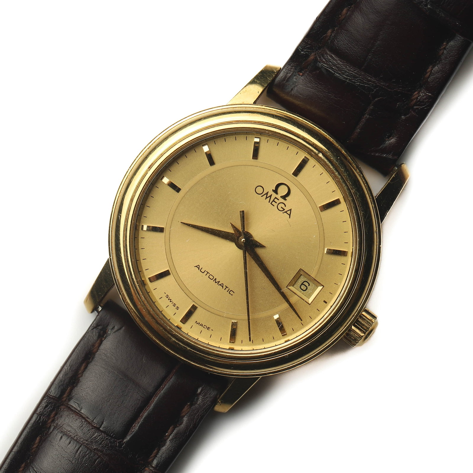 OMEGA 18K GOLD AUTOMATIC WRISTWATCH: Dimensions Dial Diameter: 1 3/16 in. (29.4 mm) Overall Length: 8 1/2 in. (21.7 cm) Weight: 31.6 g Description An Omega automatic wristwatch, crafted in 18K yellow gold, featuring a champagne dial