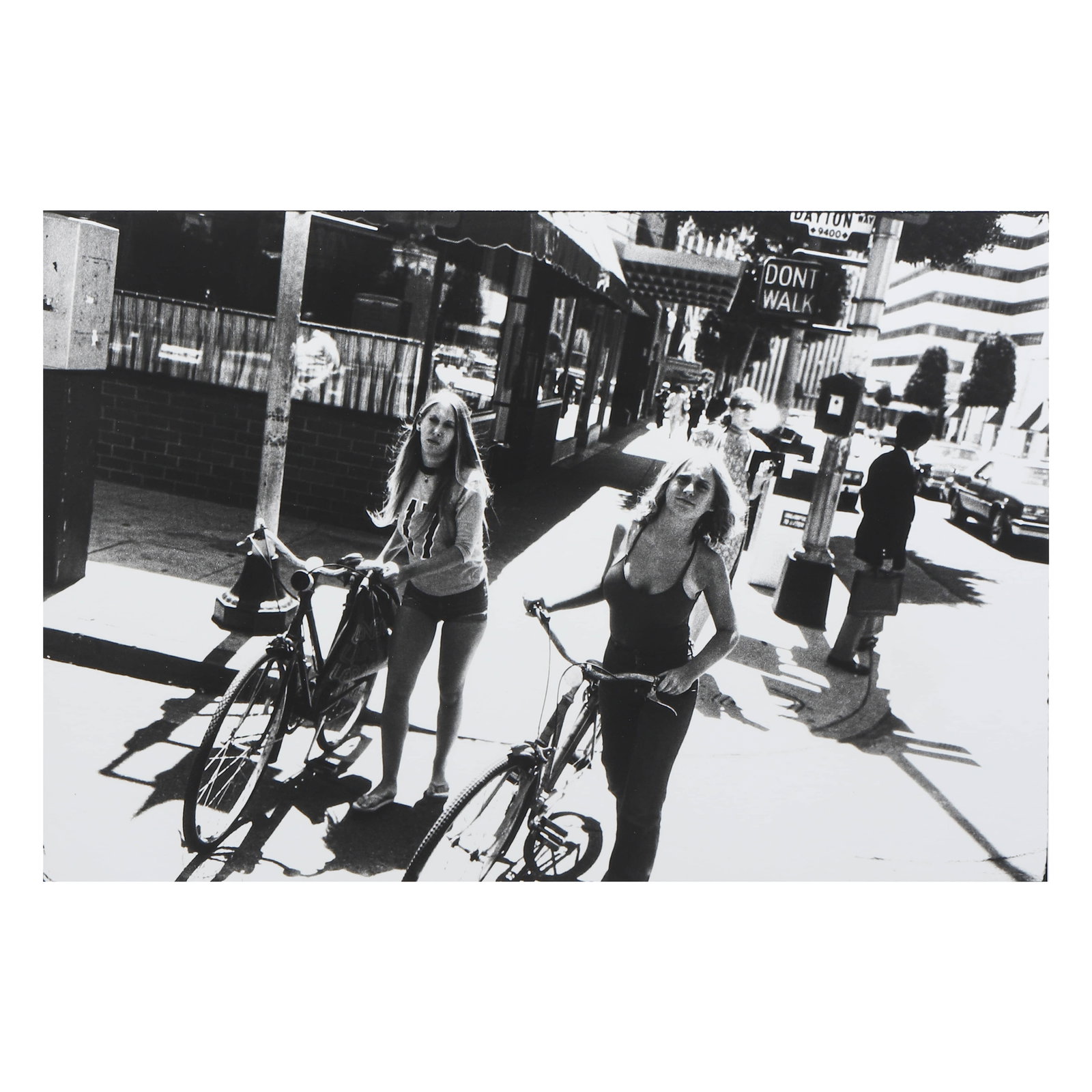 GARRY WINOGRAND (1928–1984)UNTITLED: Artist GARRY WINOGRAND (1928–1984) Title UNTITLED Medium Silver gelatin print, mounted on board Signature Stamped and signed in marker on the reverse Dimensions Image 8 13/16 × 13 1/32 in. (22.4