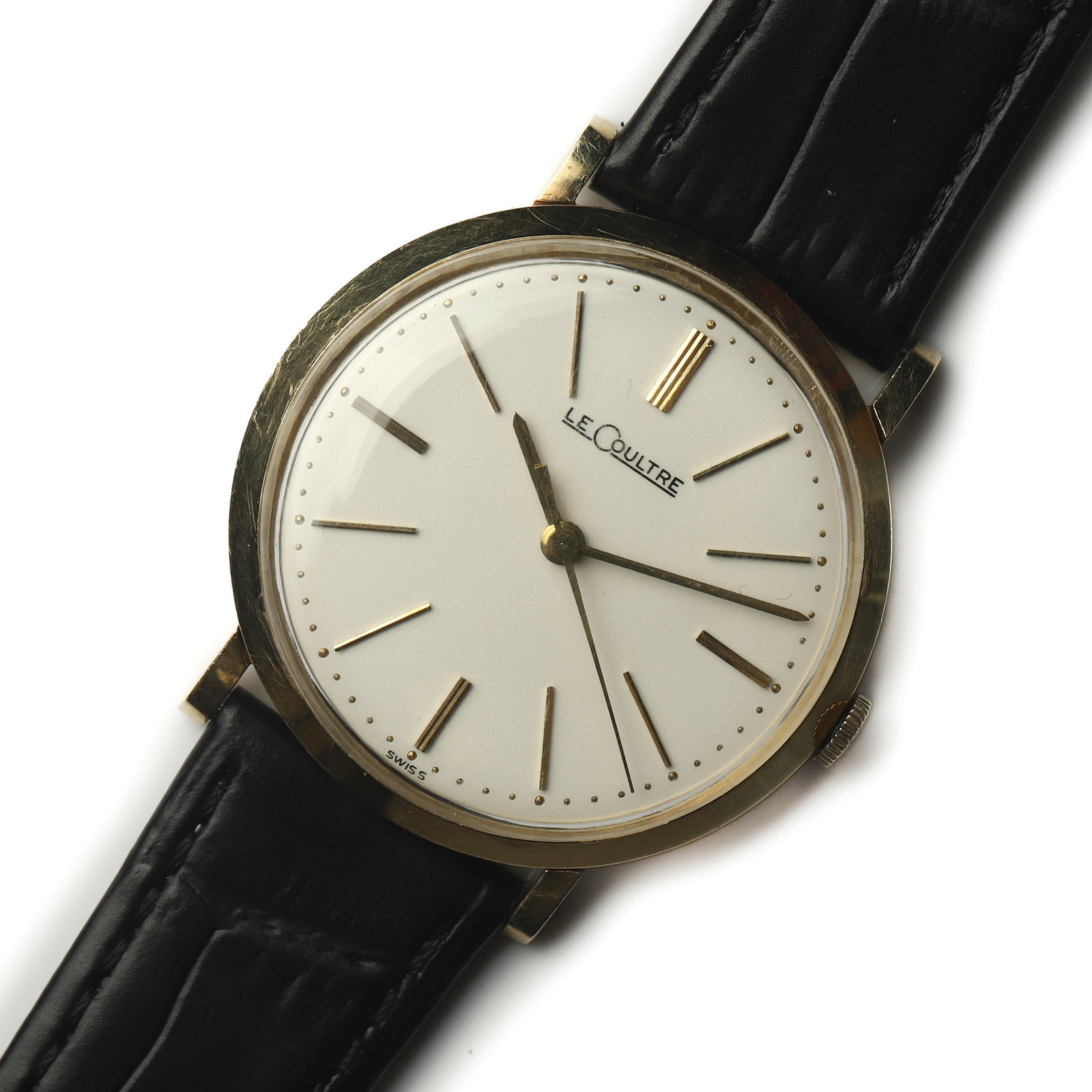 14K GOLD LECOULTRE DRESS WRISTWATCH: Dimensions Overall Length: 9 in. (22.8 cm) Case Diameter: 1 5/16 in. (33.7 mm) Weight: 27.2 g Description A LeCoultre 14K yellow gold dress wristwatch featuring a minimalist white dial with applied go