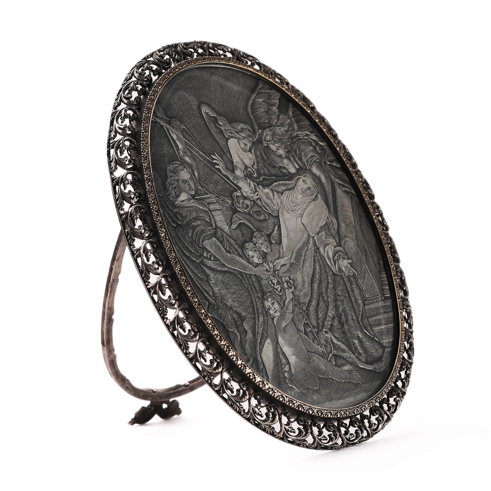 BUCCELLATI SILVER FRAME WITH ENGRAVED PLAQUE OF A RELIGIOUS SCENE: Dimensions: 4 5/8 × 3 3/4 in. (11.7 × 9.5 cm) Weight: 160 g An elaborately chased and pierced silver frame enclosing an oval engraved plaque depicting a dramatic religious scene with angels and a re