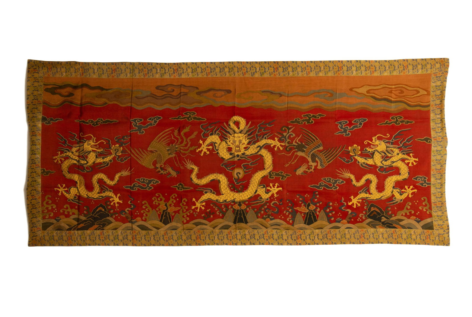 A RED?GROUND KESI WITH THREE DRAGONS: Length 215cm Width 95cm