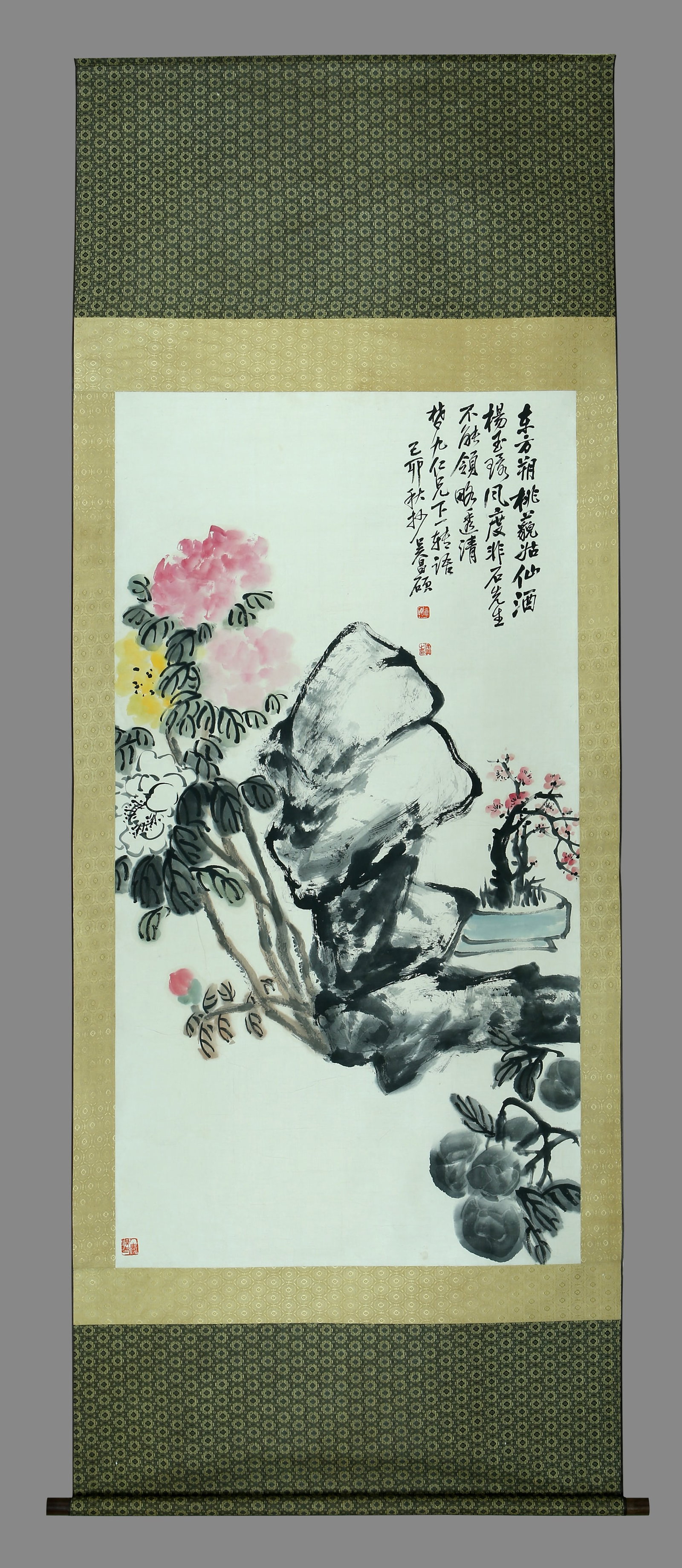 A hanging scroll of flowers painted by Wu Changshuo on paper: 150cm long and 80cm wide