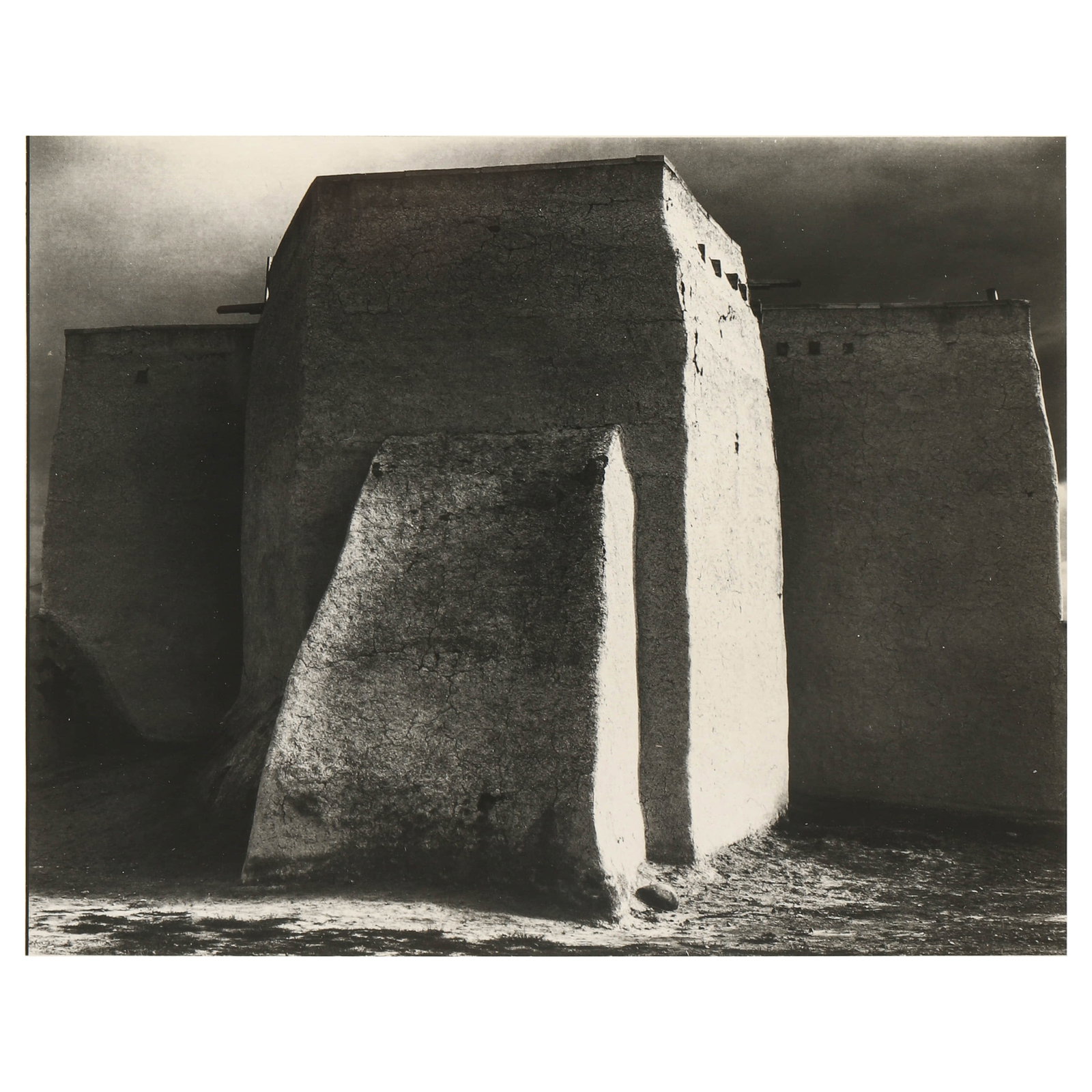 ANSEL-ADAMS-(1902–1984),-ST.-FRANCIS-CHURCH,-RANCHOS-DE-TAOS,-NEW-MEXICO: Artist Ansel Adams Title ST. FRANCIS CHURCH, RANCHOS DE TAOS, NEW MEXICO Medium Silver gelatin print, mounted on board Signature Signed in pencil, lower right recto Dimensions Image 7.48 × 9.49 in. (