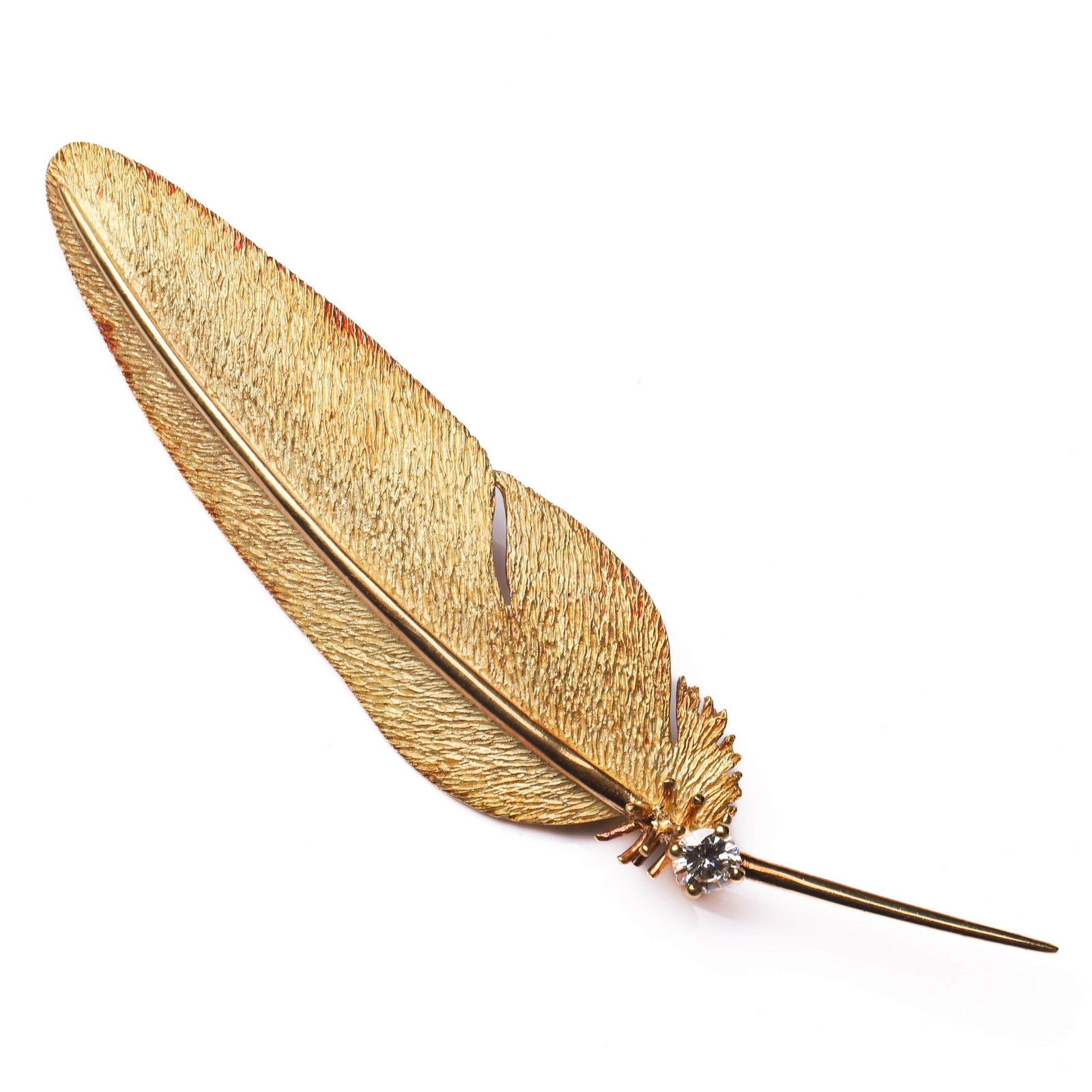 MID-20TH-CENTURY-(CIRCA-1940–1960),-A-FRENCH-GOLD-FEATHER-BROOCH-WITH-DIAMOND,-EAGLE-HEAD-MARK: Dimensions 2 15/16 × 11/16 in. (75 × 18 mm); Weight: 7.25 g Description A European antique gold feather brooch from a French atelier, dating to the mid-20th century (circa 1940–1960), representing