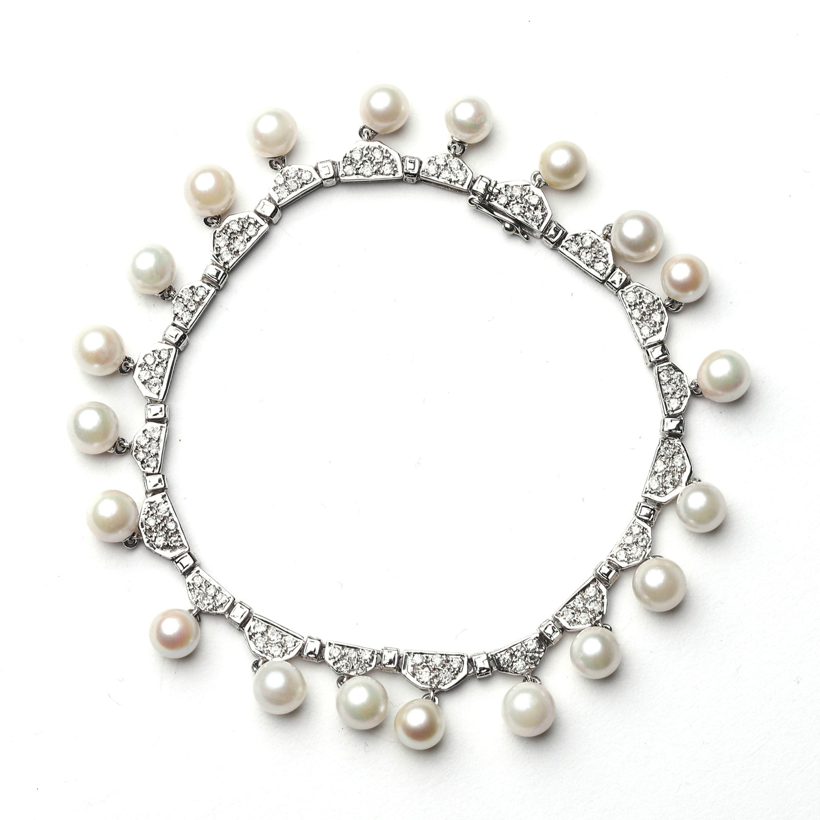 ART-DECO-PERIOD-18K-GOLD,-DIAMOND,-AND-PEARL-BRACELET: Length: 7 7/8 in. (20 cm), Weight: 20.5 g This Art Deco-era bracelet is a stunning piece crafted from 18k gold, adorned with diamonds and pearls. The symmetrical design typical of Art Deco style