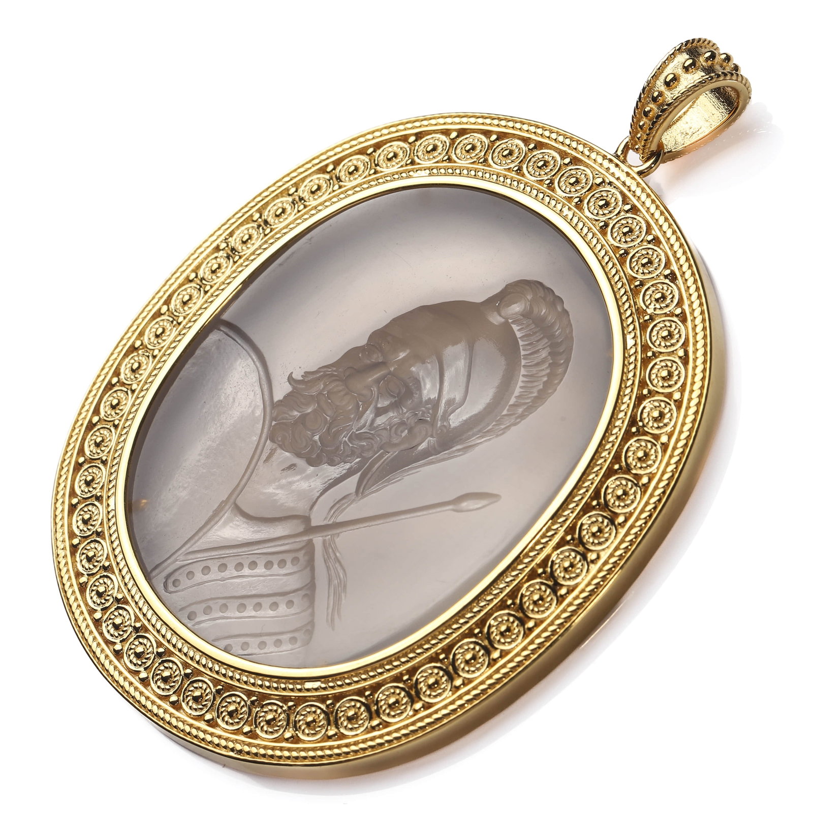 GOLD-AND-BANDED-AGATE-INTAGLIO-PENDANT-DEPICTING-A-GREEK-WARRIOR: Dimensions 2 3/4 × 2 in. (7 × 5.1 cm) weight 33.5g Description The pendant set with a finely carved banded agate intaglio depicting a bearded Greek hoplite, wearing a crested Corinthian helmet and