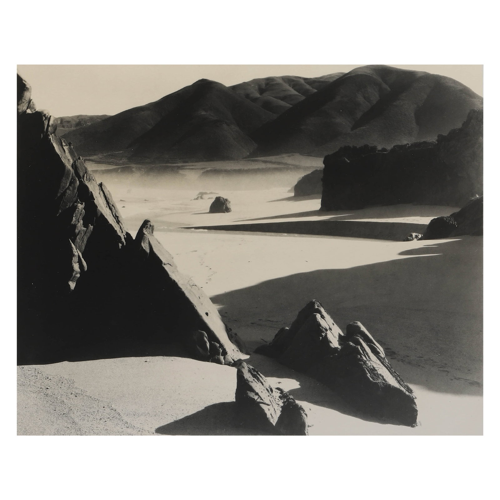 BRETT-WESTON-(1911–1993)GARRAPATA-BEACH: Artist BRETT WESTON (1911–1993) Title GARRAPATA BEACH Medium Silver gelatin print, mounted on board Signature Pencil signed on recto Dimensions Photograph: 7 3/8 × 9 3/8 in. (18.8 × 23.8 cm) Frame