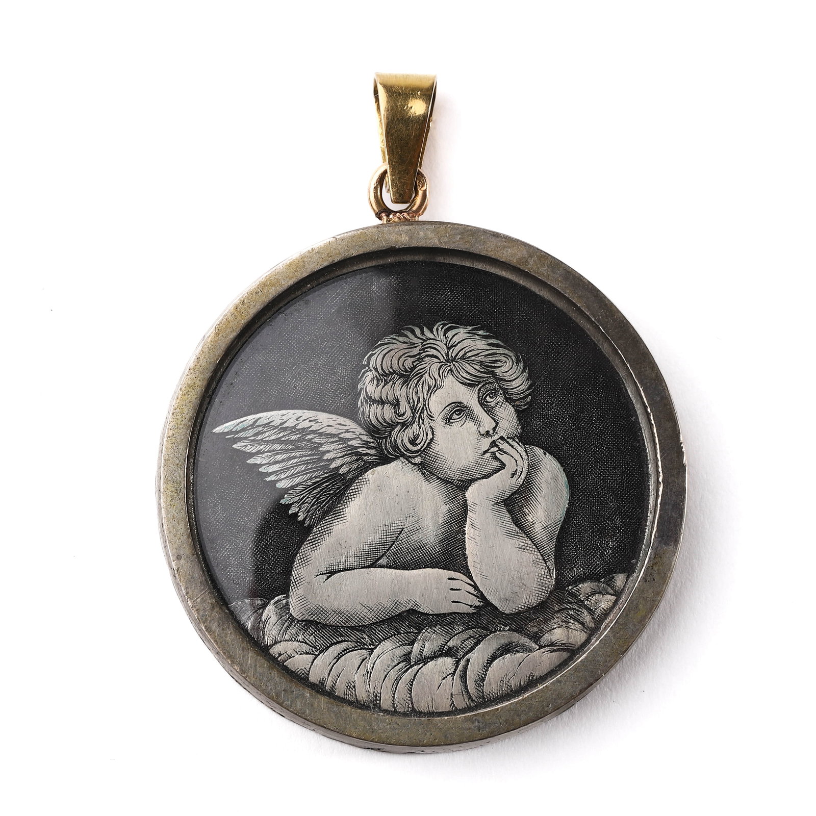A-FRENCH-ENGRAVED-GLASS-PORTRAIT-PENDANT-DEPICTING-A-PUTTO,-EARLY-20TH-CENTURY: Dimensions: Diameter: 1 5/8 in. (41.1 mm); Weight: 25.7 g Description: This circular pendant features a finely engraved depiction of a cherubic putto resting thoughtfully on clouds, rendered with
