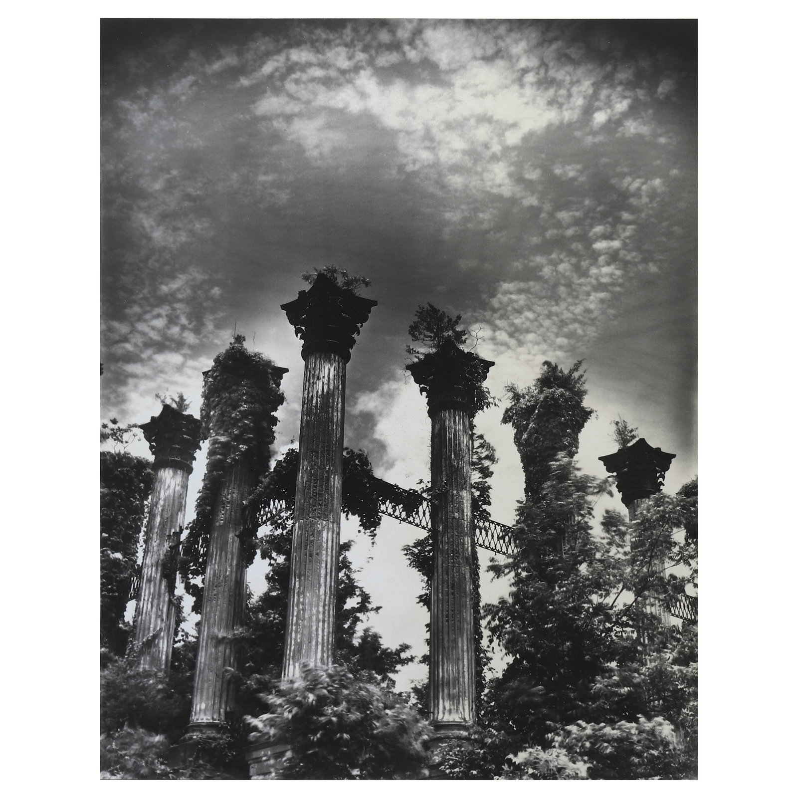 CLARENCE-JOHN-LAUGHLIN-(1905–1985)THE-ENIGMA: Artist CLARENCE JOHN LAUGHLIN (1905–1985) Title THE ENIGMA Medium Silver gelatin print, mounted on board Signature Pen signed on recto Dimensions Photograph: 10 1/2 × 13 5/16 in. (26.7 × 33.8 cm) 