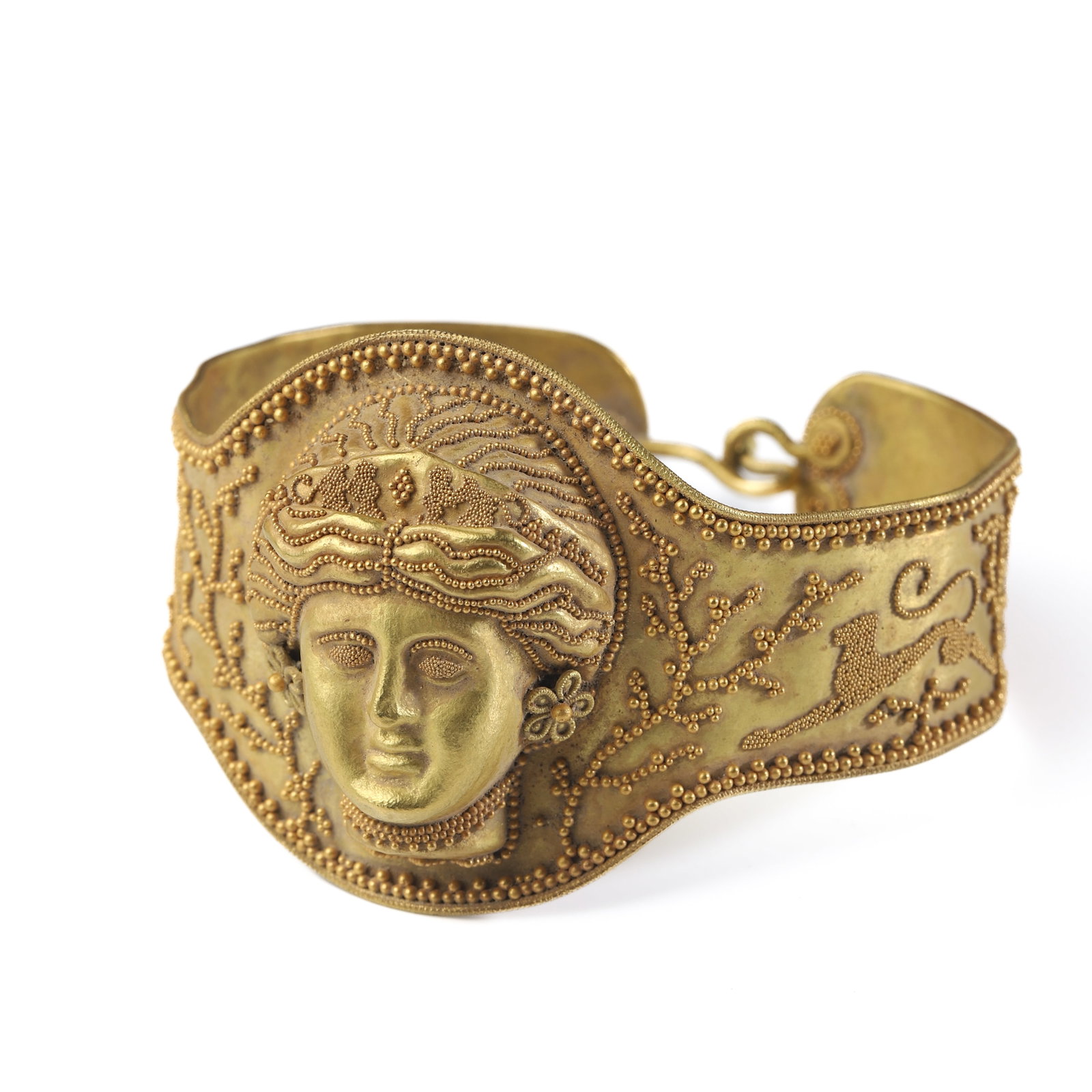 AN-ANCIENT-ROMAN-GOLD-GODDESS-REPOUSSÉ-AND-GRANULATION-BRACELET: Dimensions Fits wrists up to approximately 6 1/2 in. (16.5 cm) Weight 37.2 g Description An Ancient Roman gold bracelet dating to the Roman period, circa 753 B.C.–A.D. 476. The bracelet is finely