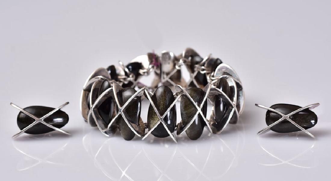 Antonio Pineda Bracelet and Earring Set: obsidian stones set in .970 silver 6" diameter bracelet, 1 1/8" long earrings stamped Taxco/Antonio in a crown
