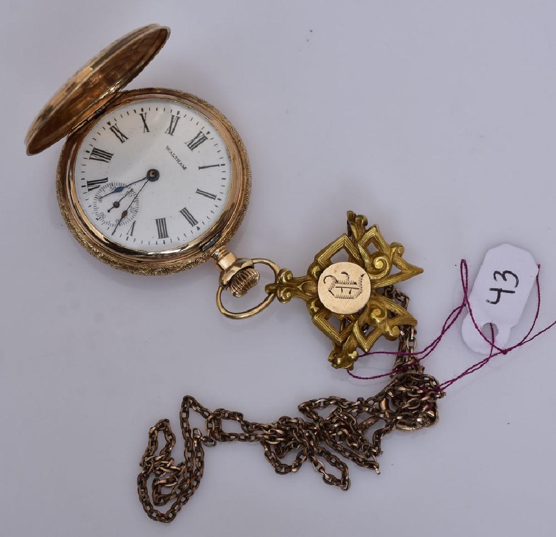 Waltham 14k Gold Ladies Pocket Watch: 1 1/4" face with non-gold Victorian fob together with 14k gold moonstone stick pin