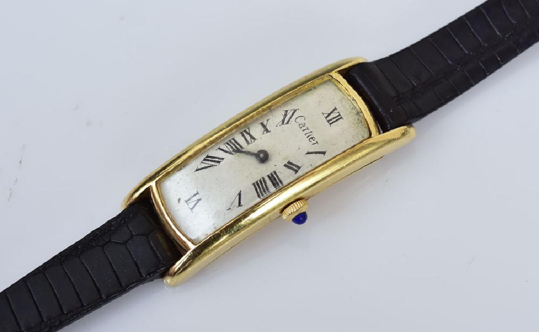 Cartier 18k Gold Curvex Wrist Watch: movement and inside of back case is stamped "Bueche Girod"case measures 40mm x 15mm excluding stemwith leather bracelet