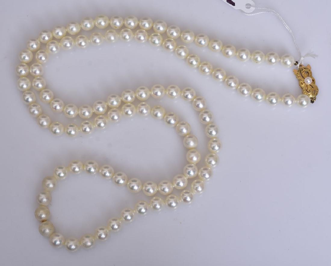Mikimoto Cultured Pearl Necklace: 7 mm pearls, 30" long necklace with 18k gold signed clasp SHIPPING: Shipping available within the Continental USA (excludes insurance) $25. International buyers are responsible for arranging 3rd party