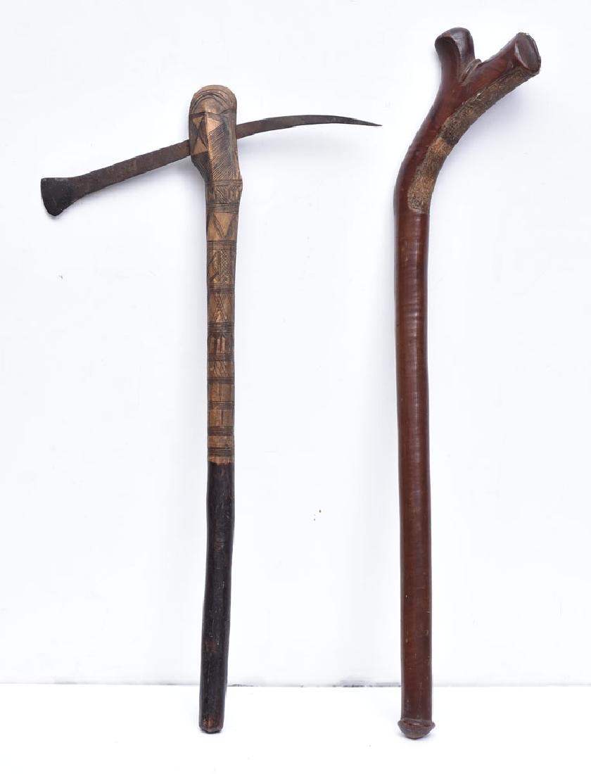 Two Oceanic War Clubs: Oceanic gun stock club, probably Fiji, 32" long and carved line decorated club with blade, probably Oceanic, 28 3/4" long