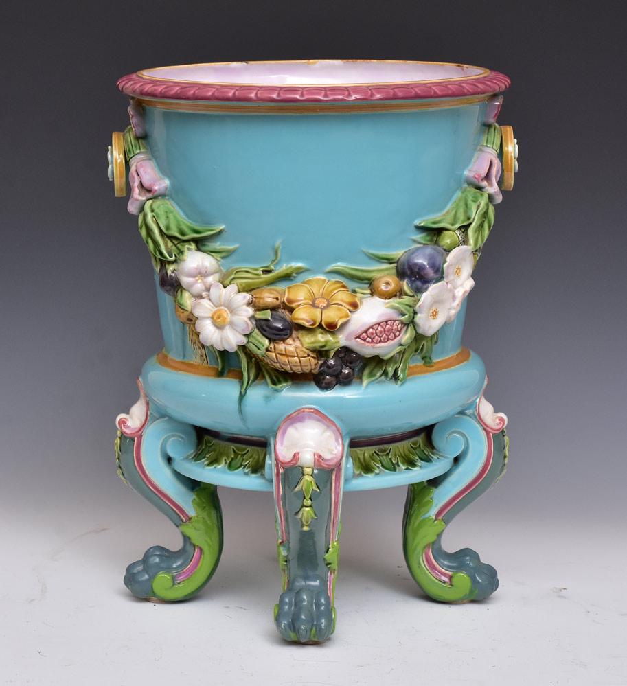 Minton Majolica Wine Cooler: with flowers and vegetables on a blue ground with lion paw feet 15 1/2" tall 11 1/2" wide late 19th century