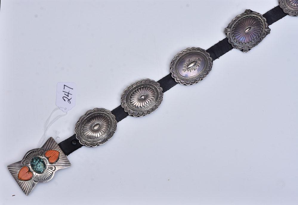 Navaho Concho Belt: 3" long buckle signed J. Blackgoat with 10 conchos, each 2 1/2" long and each with a unique design, 48" long belt