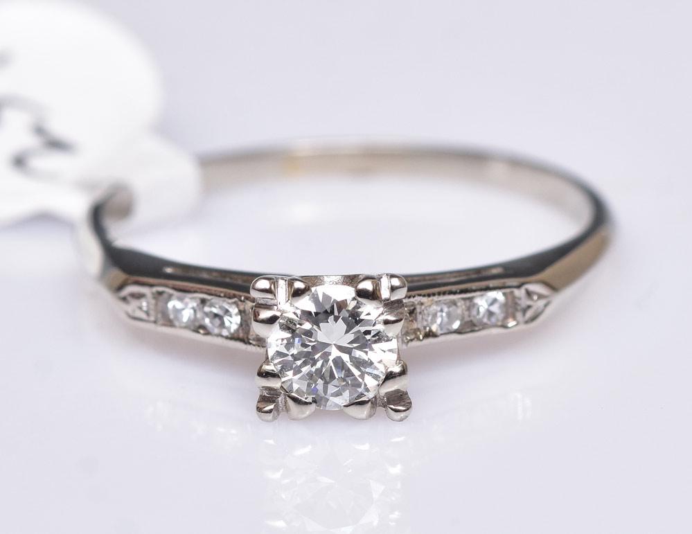 14k Gold Diamond Ring: approximately .5 ct center diamond ring size 10 1/2, 2.1 dwt gross