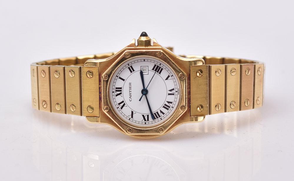 Cartier 18k Gold Santos Wrist Watch: octagonal face with date window 33 mm diameter case, circa 1990 78.4 dwt gross