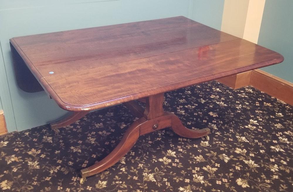 English Mahogany Dining Room Table: with drop leaves and brass feet 53" x 24 3/4", 27 1/2" high early 19th century