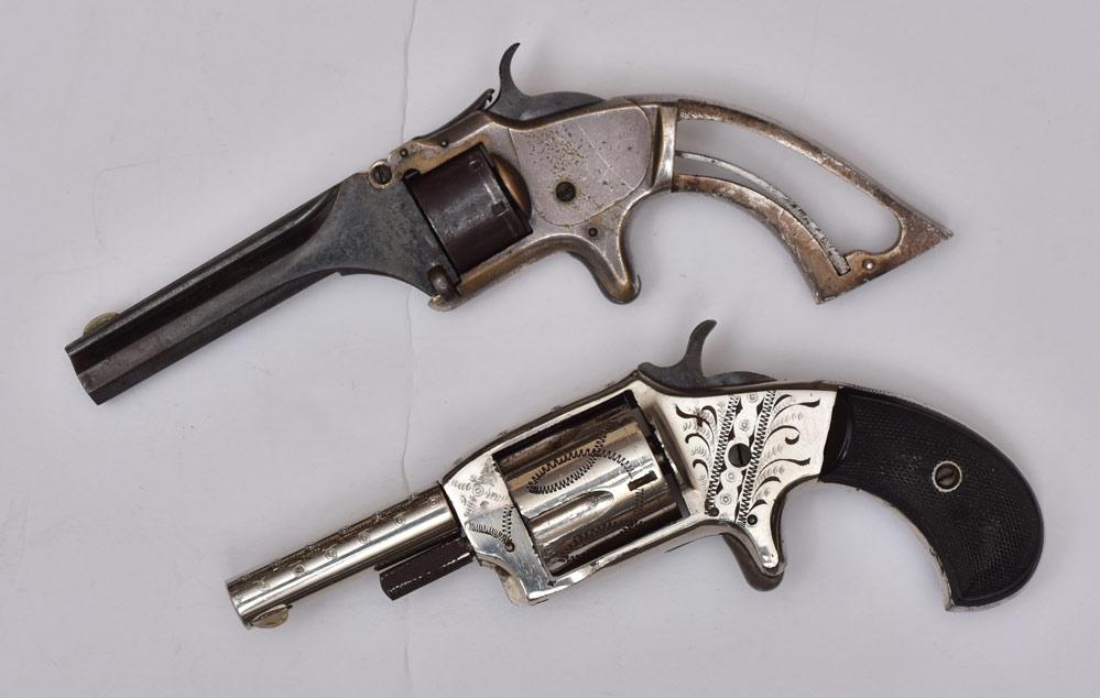Two Antique Revolvers: Smith & Wesson Spur Trigger Revolver 3 1/4" octagonal barrel, 7" long Springfield, MA, serial # 39606 and engraved Defender, 2" barrel, 6 1/2" long mid-19th century