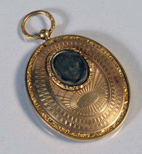 VICTORIAN 14KT GOLD LOCKET inset with photo of a c: VICTORIAN 14KT GOLD LOCKET inset with photo of a child and daguerreotype of gentleman 34 grams circa 1860