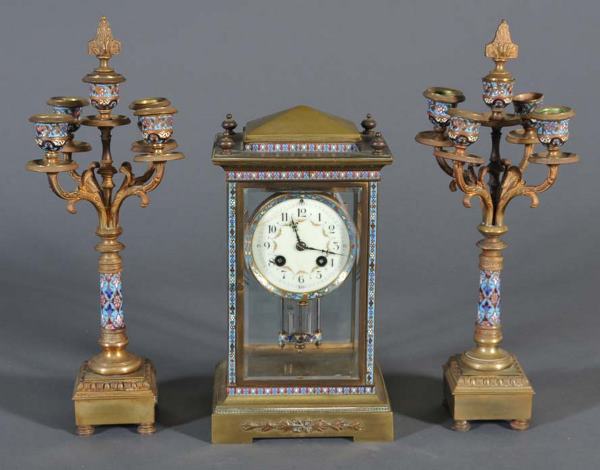 FRENCH CHAMPLEVE CRYSTAL REGULATOR AND GARNITURE S: FRENCH CHAMPLEVE CRYSTAL REGULATOR AND GARNITURE SET signed Marti, 11" high (clock) 15" high (candelabra) late 19th century
