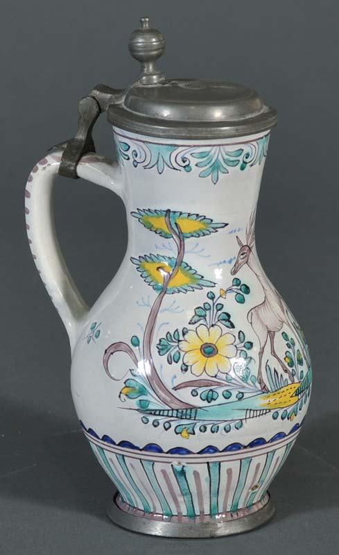 CONTINENTAL FAIENCE TANKARD with a stag in a lands: CONTINENTAL FAIENCE TANKARD with a stag in a landscape 9" high 18th century