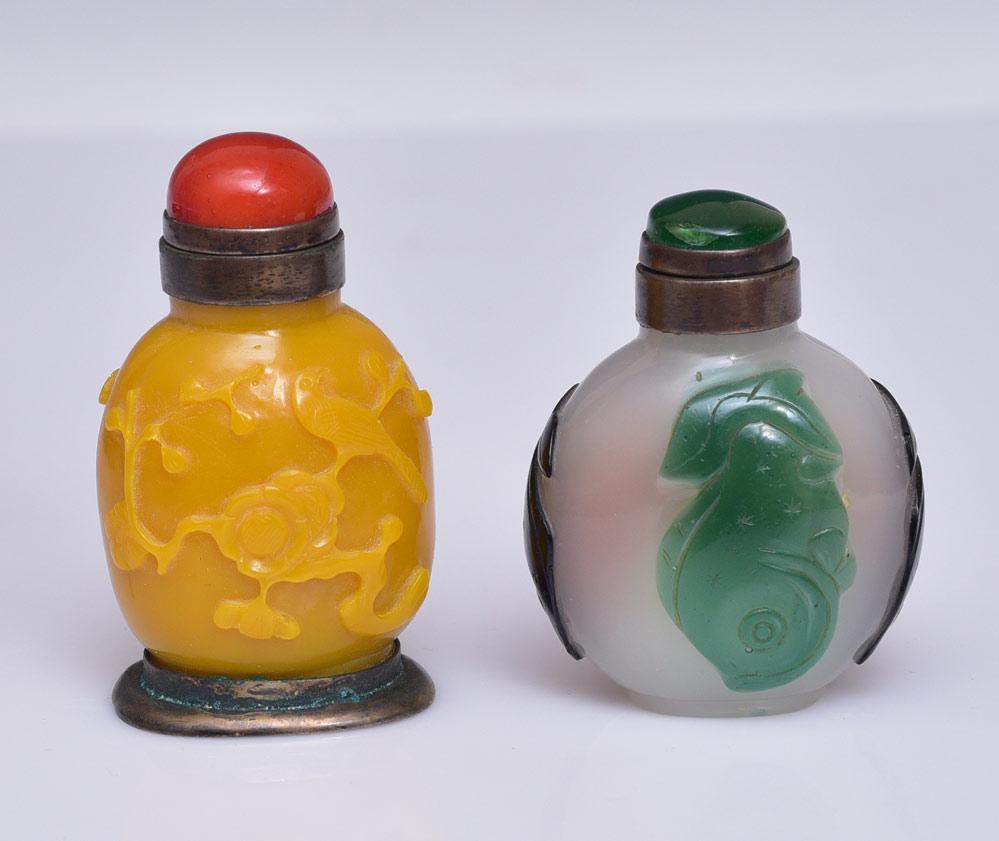 Two Carved Peking Glass Snuff Bottles (1 of 2)