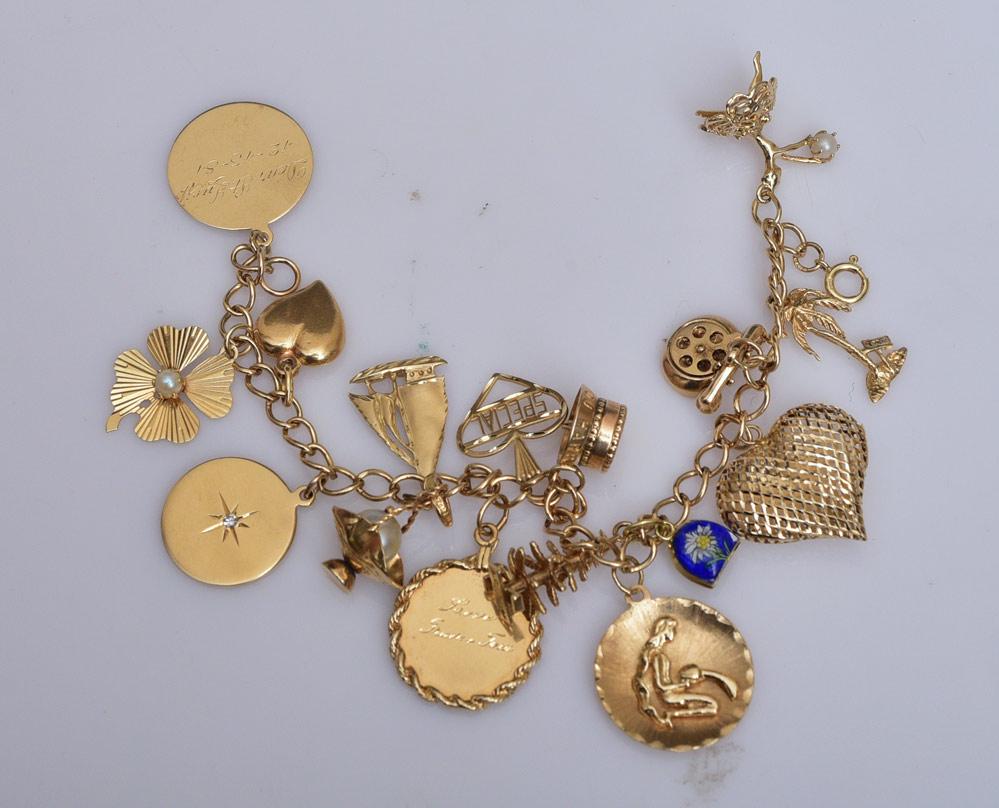 14k Gold Charm Bracelet: with 14k gold charms (16), 23 dwt gross