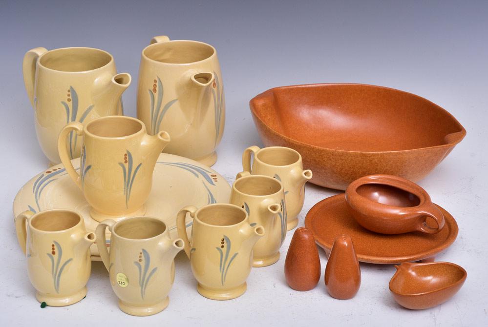 Roseville Pottery "Utility Ware" and Raymor: Utility Ware "Lilies of the Valley", two plates, 12 1/2" diameter, 8 pitchers: 7 1/2" high (2), 5 1/4" high (1) and 4 1/4" high (5). Rayor serving bowl #185, 14" x11", trivet, salt and pepper and two