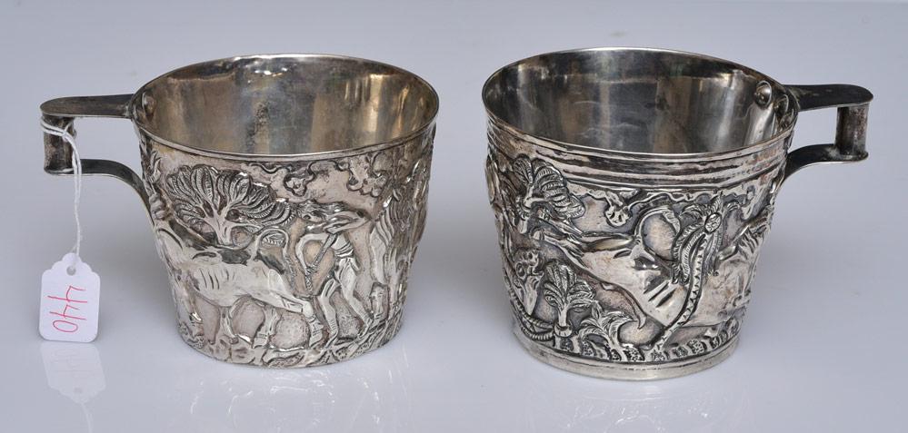 Ilias Lalaounis Grecian Sterling Silver Cups (2): with repousse decoration of bulls, 3" and 3 1/4" high marked "Lalaounis/925" 11.9 troy ounces