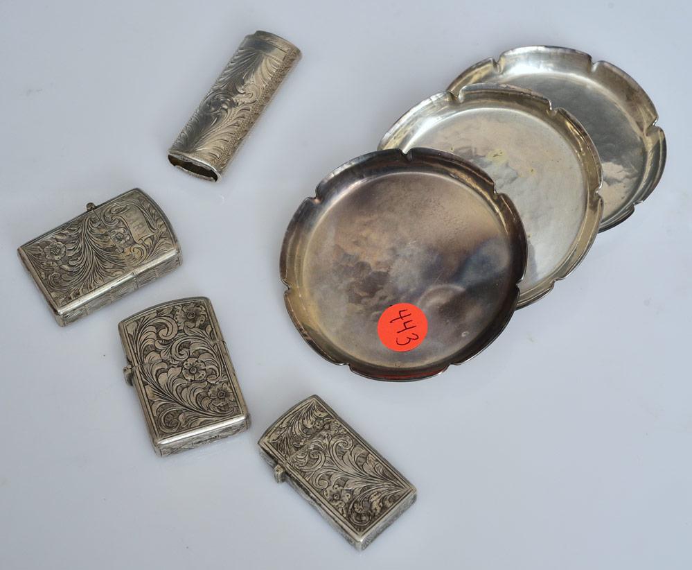 Joel F. Hewes Saucers and Four Silver Lighters: three sterling hammered saucers, 3 3/4" diameter, 7.7 troy ounces all signed "JOEL F. HEWES/STERLING/ HANDMADE" together with four engraved silver lighters,2.4 troy ounces (silver cases only)