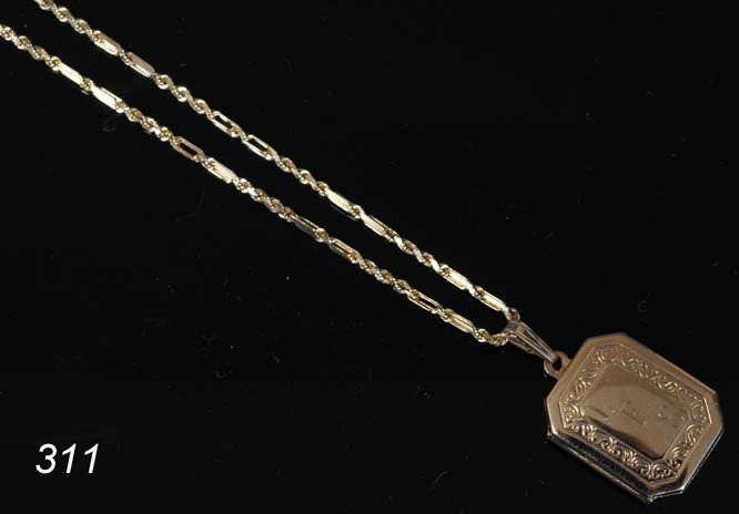 14KT GOLD LOCKET WITH CHAIN monogramed "LFS" 8 gra: 14KT GOLD LOCKET WITH CHAIN monogramed "LFS" 8 grams Shipping Information: Packing and shipping available within the Continental USA (excluding insurance):$20