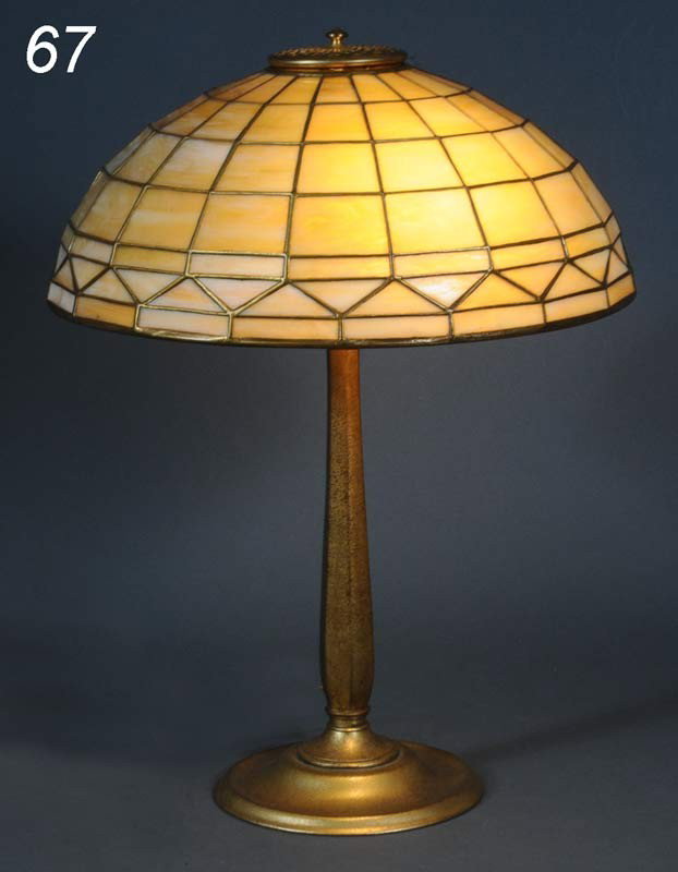 TIFFANY STUDIOS TABLE LAMP with "Colonial" leaded g: TIFFANY STUDIOS TABLE LAMP with "Colonial" leaded glass shade 16" diameter, 3.5" fitter, early 20th century Shipping Information: Buyer is responsible for arranging 3rd party shipping