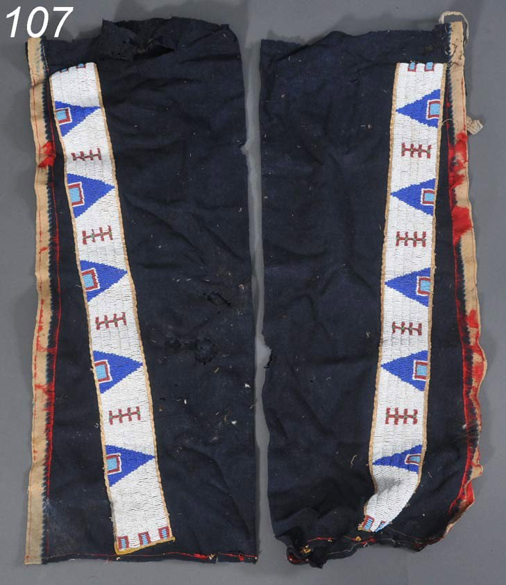 PAIR OF SIOUX BEADED LEGGINGS each leg with a tapp: PAIR OF SIOUX BEADED LEGGINGS each leg with a tappered band of beadwork, with remanants of red silk piping on outside edges and bottoms 32" long overall, circa 1900 Shipping Information:$30 Packing an