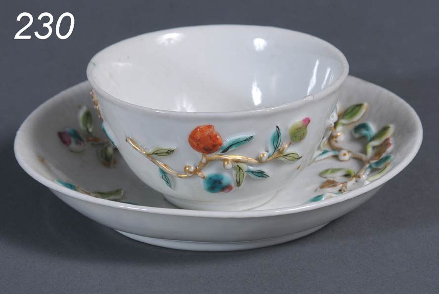 CHINESE EXPORT TEA CUP AND SAUCER with raised and: CHINESE EXPORT TEA CUP AND SAUCER with raised and colored decoration saucer 4 1/2" diameter cup 2 3/4" diameter, 18th century Shipping Information:$25 Packing and shipping available within the Contine