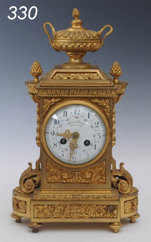 FRENCH BRONZE CLOCK face marked Susse Freres 13" h: FRENCH BRONZE CLOCK face marked Susse Freres 13" high Shipping Information:$40 Packing and shipping available within the Continenal USA (excludes insurance which will be added based on selling price).