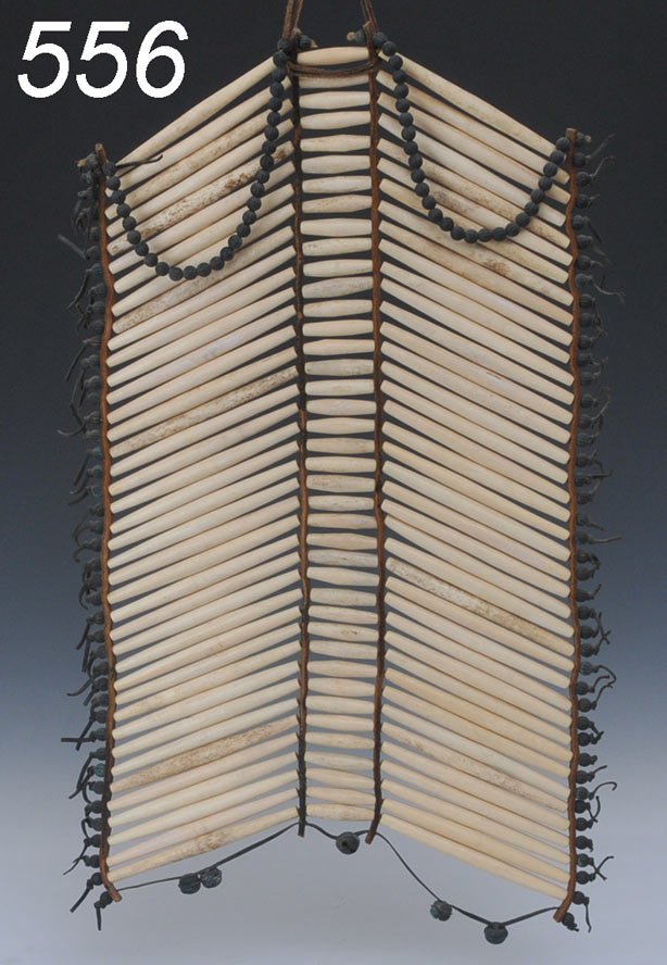 SIOUX HAIR PIPE BREAST PLATE with hide and bell fr: SIOUX HAIR PIPE BREAST PLATE with hide and bell fringe 16 1/2"x 12" Shipping available within the Continenal USA (listed amount excludes insurance which will be added based on hammer price.) $30