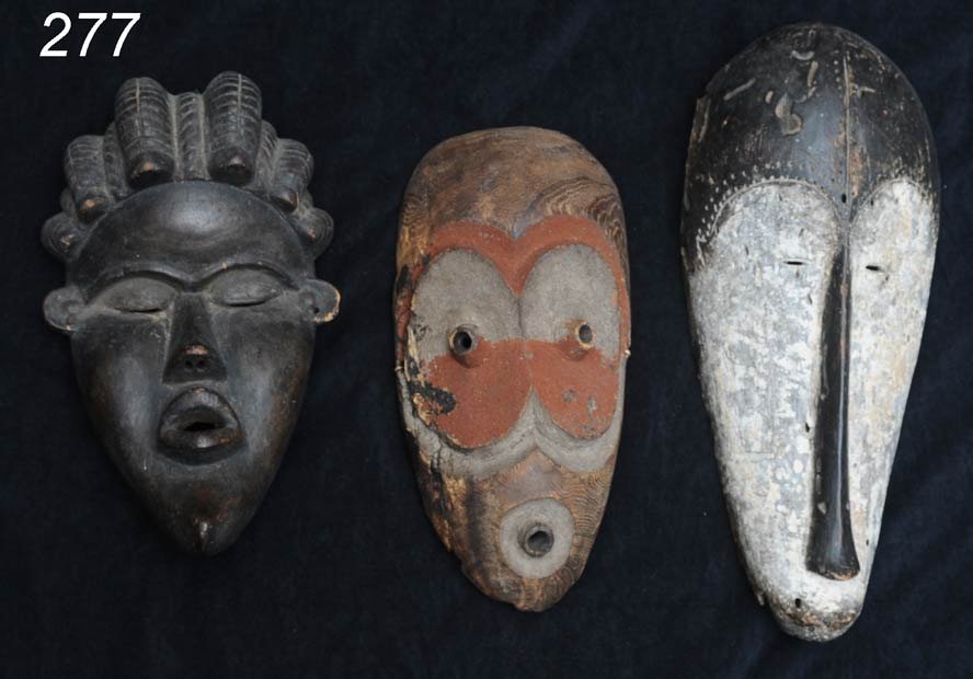 THREE AFRICAN MASKS including Dan Tribe 12" to 16": THREE AFRICAN MASKS including Dan Tribe 12" to 16" long Shipping Information: Buyer is responsible for arranging 3rd party shipping