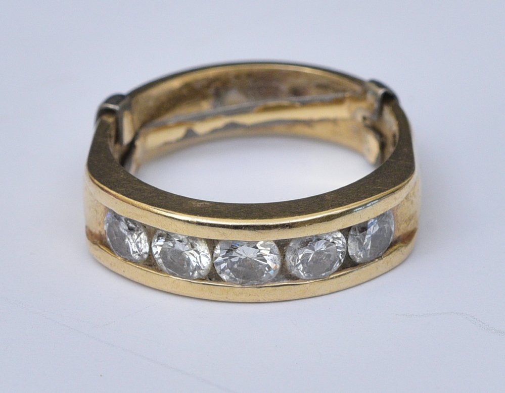 14k Gold Diamond Ring: set with five diamonds, approximately .75 ct tw, ring size 5 1/2, weight is 3.7 dwt gross