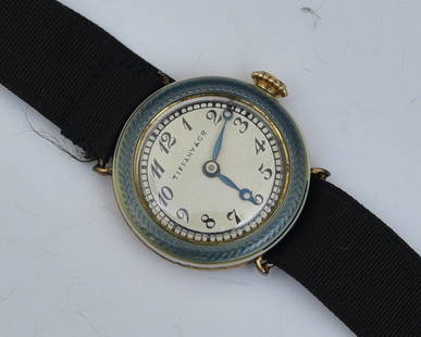 Tiffany & Co 18k Gold Ladies Enameled Wrist Watch: 22 mm diameter enameled case on a ribbon band with 18k gold clasp, 9 dwt gross, early 20th century